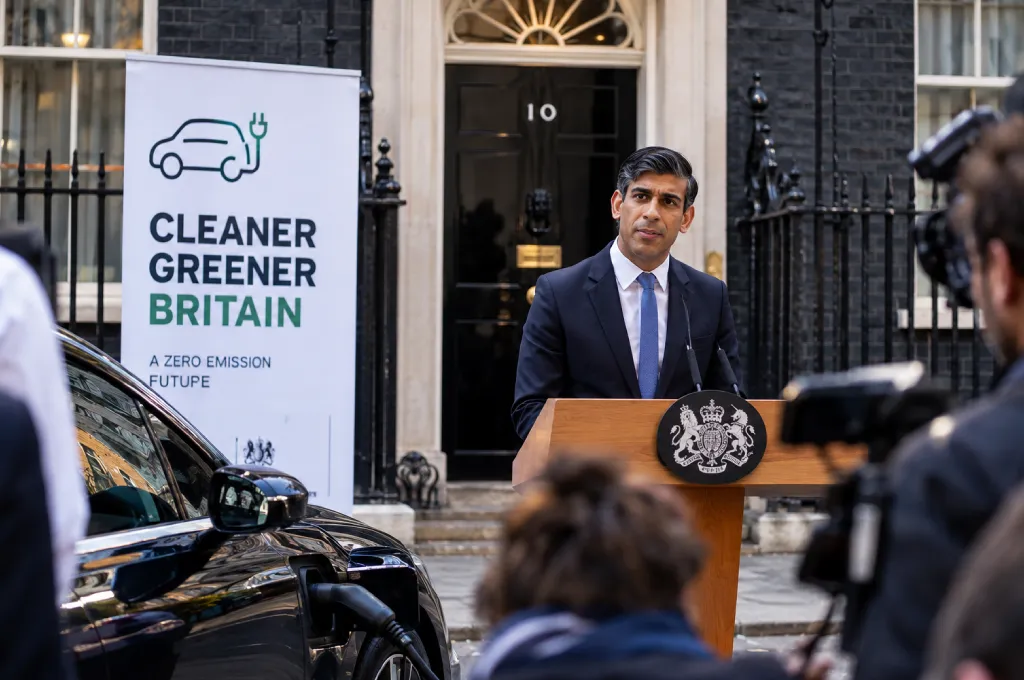 electric car - EV Pioneer calls for relaxation of transition target - Corporate boardroom strategy meeting